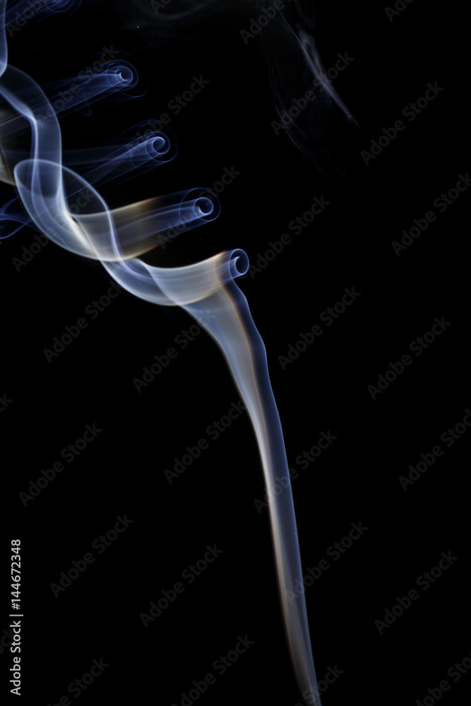 Abstract art. Color white blue smoke from the aromatic sticks on a black background. Background for Halloween. Texture fog. Design element. The concept of aromatherapy. Abstract art. Color white blue smoke from the aromatic sticks on a black background. Background for Halloween. Texture fog. Design element. The concept of aromatherapy.
