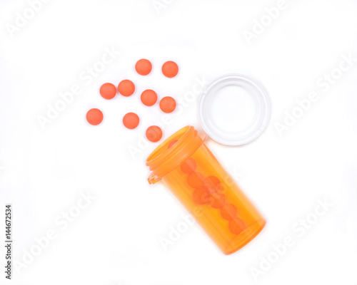 Wallpaper Mural Orange pills in plastic bottle with a cap isolated on white background Torontodigital.ca