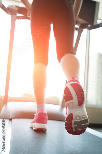 woman running on treadmill © ryanking999