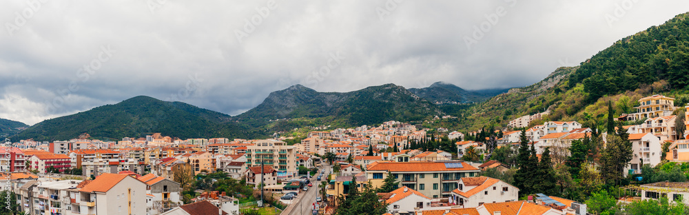 New homes in Budva, Montenegro. New town. Real estate on the shores of the Adriatic Sea. House with orange roof tiles