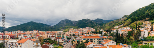 New homes in Budva, Montenegro. New town. Real estate on the shores of the Adriatic Sea. House with orange roof tiles © Nadtochiy