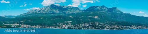 Herceg Novi, the view from the shore on the contrary, against the background of mountains and sky, Montenegro, Adriatic