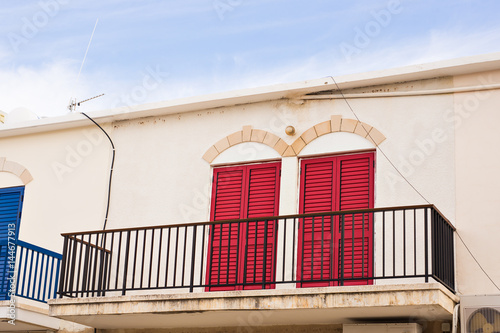 balcony with red doors photo