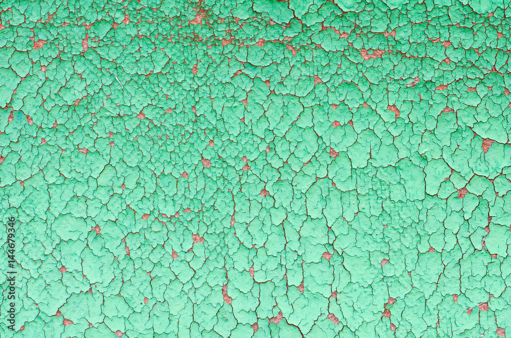 background old cracked paint on a wooden surface background old cracked paint on a wooden surface