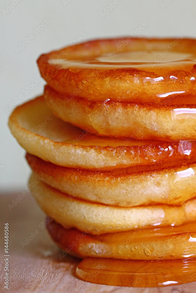 Appetizing pancakes on a light blurred background Appetizing pancakes on a light blurred background