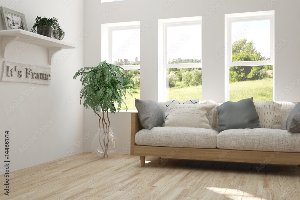 Fototapeta premium White room with sofa and green landscape in window. Scandinavian interior design. 3D illustration