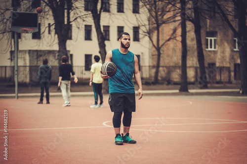 African-american streetball player practicing outdoors © Nejron Photo