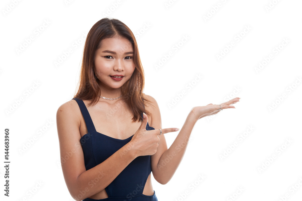Beautiful young Asian woman point to palm hand. Beautiful young Asian woman point to palm hand.