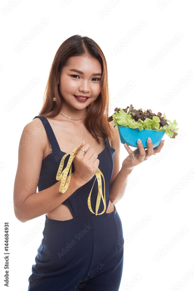 Healthy Asian woman with measuring tape and salad. Healthy Asian woman with measuring tape and salad.