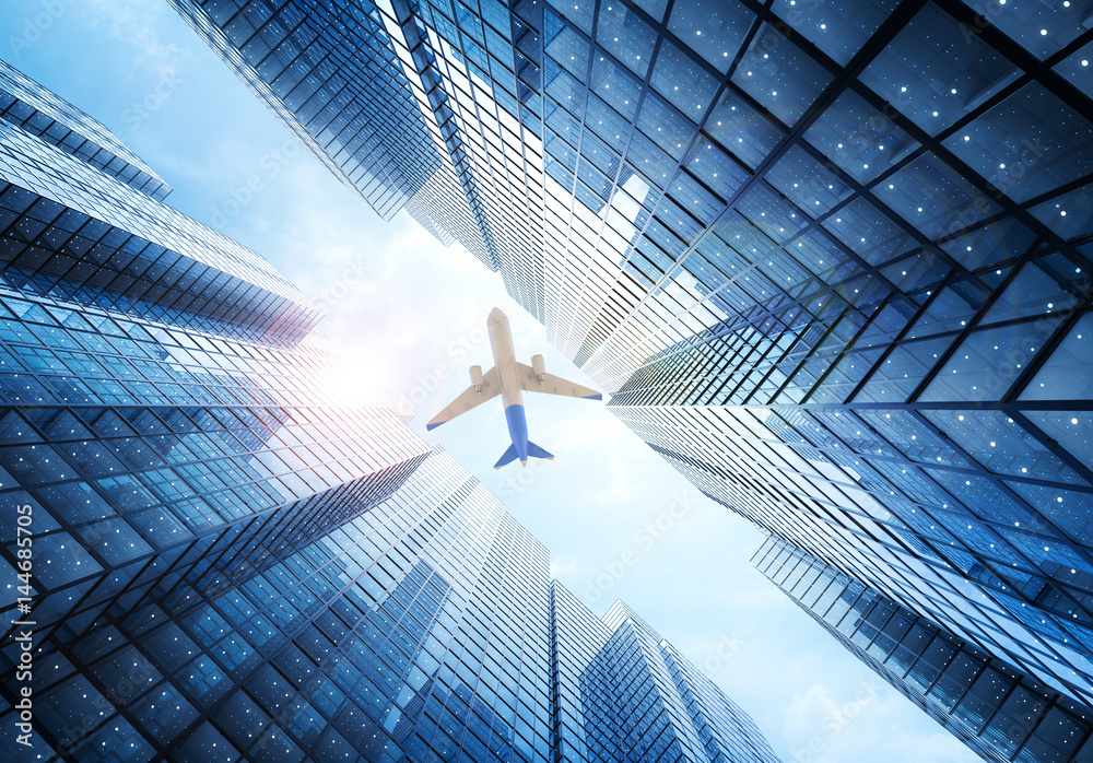 Fototapeta premium airplane flying above building