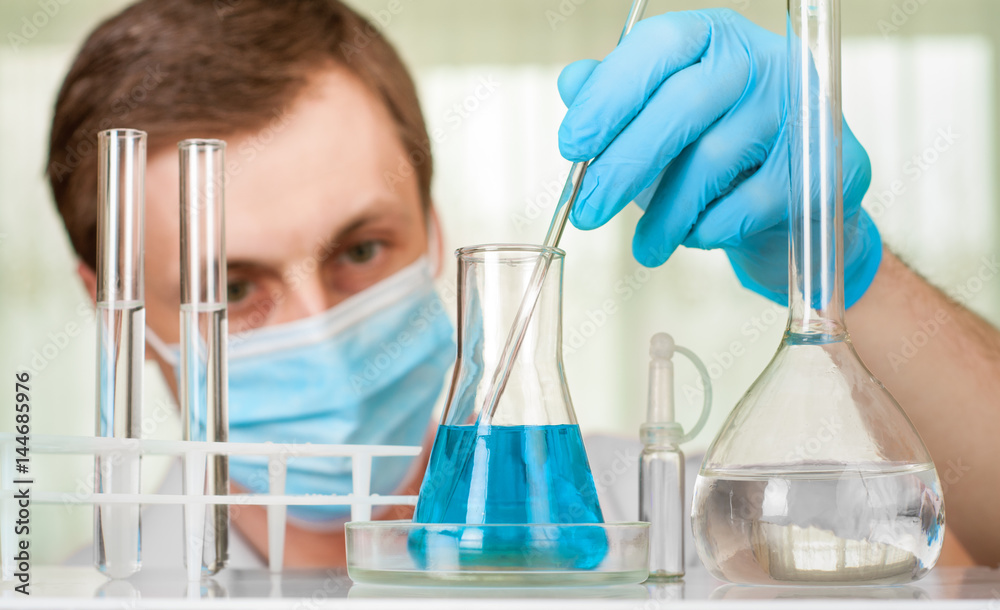 Laboratory scientist working at lab with test tubes Laboratory scientist working at lab with test tubes