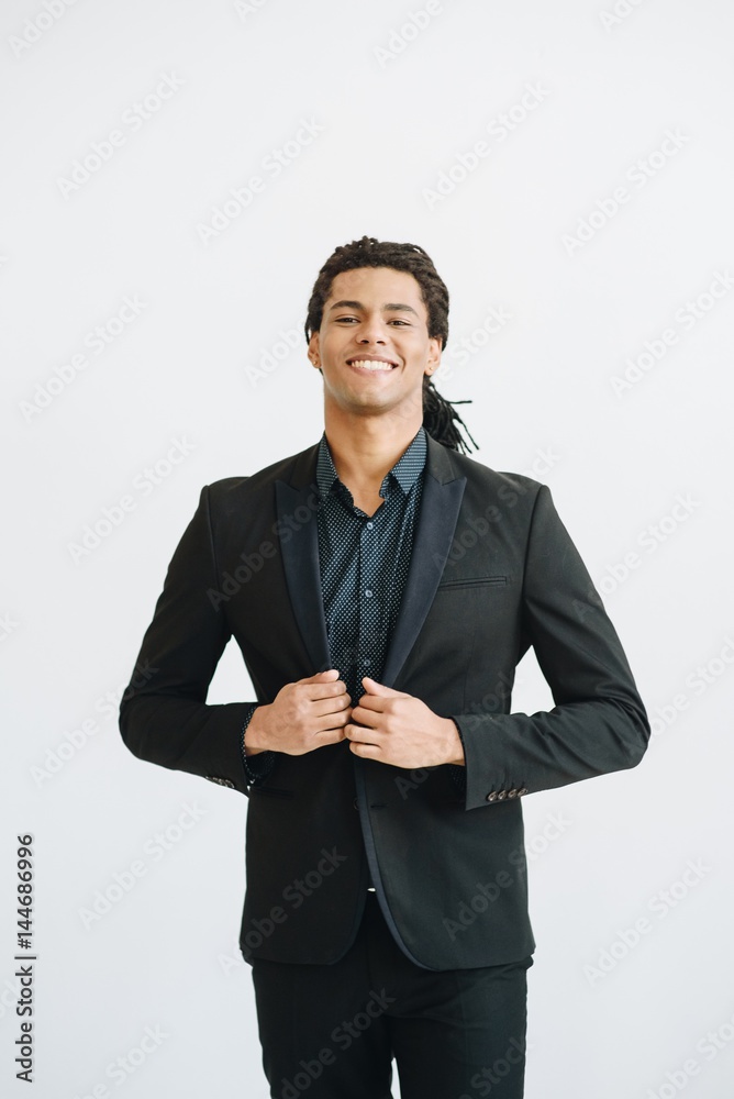 Happy young businessman in black suite Happy young businessman in black suite