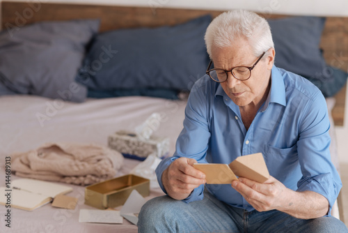 Fényképezés Good looking aged man reading a note