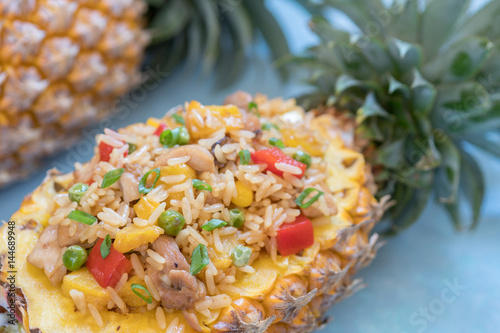 Pineapple stuffed with fried rice, chicken and vegetables