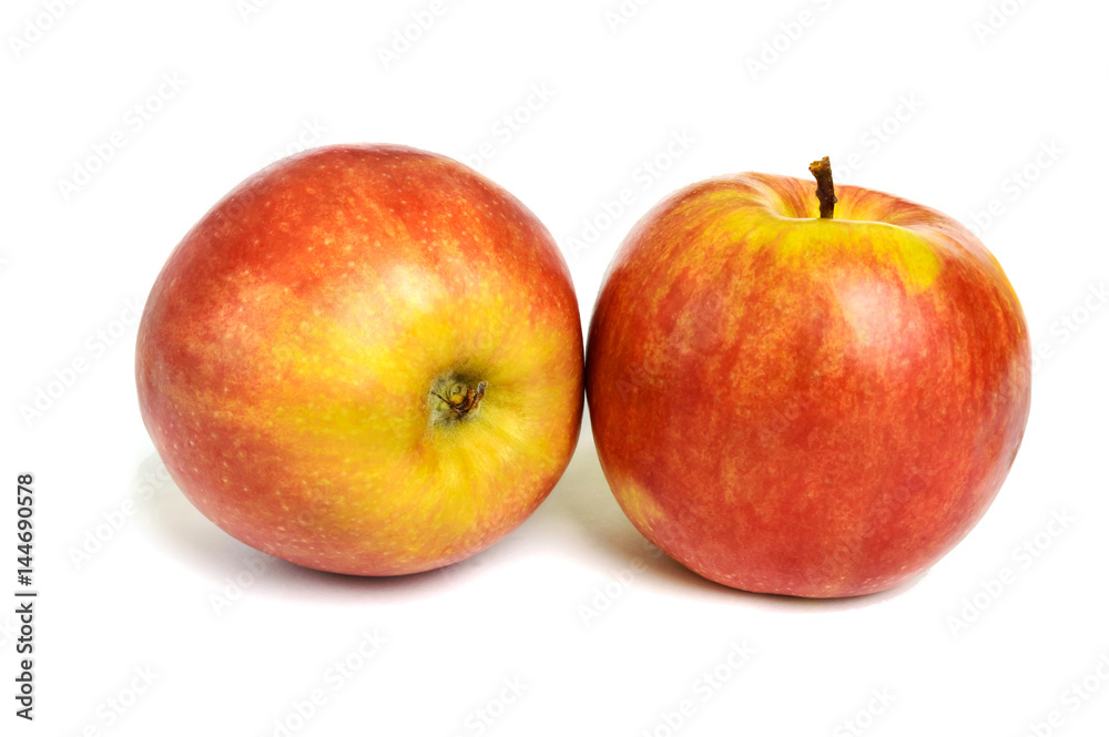 Two ripe ruddy red-yellow apple isolated on white background. Two ripe ruddy red-yellow apple isolated on white background.