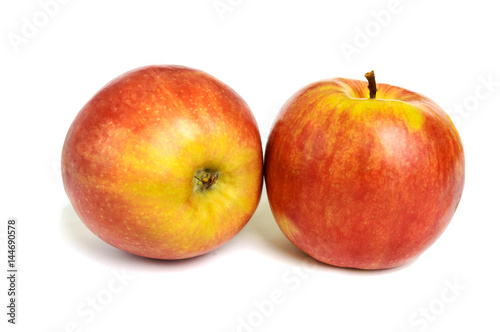Two ripe ruddy red-yellow apple isolated on white background.