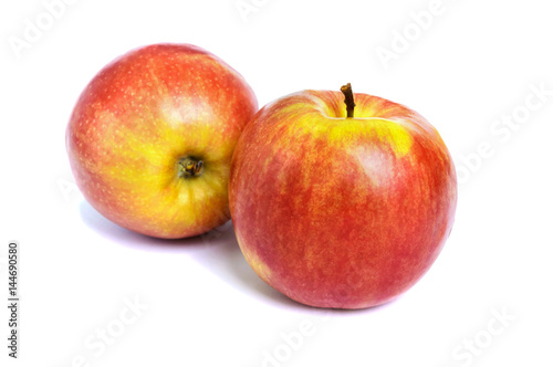Two ripe ruddy red-yellow apple isolated on white background.