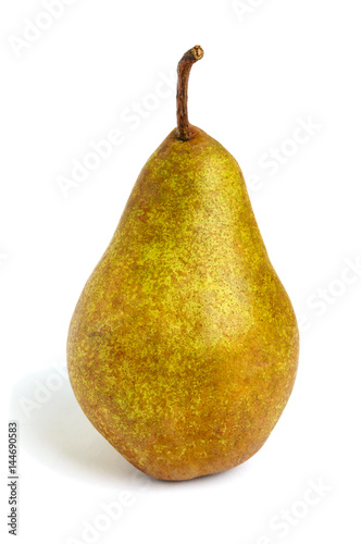 A large yellow (brown) pear stands straight isolated on a white background.