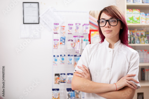 Pharmacist in front of her desk. Healthcare business