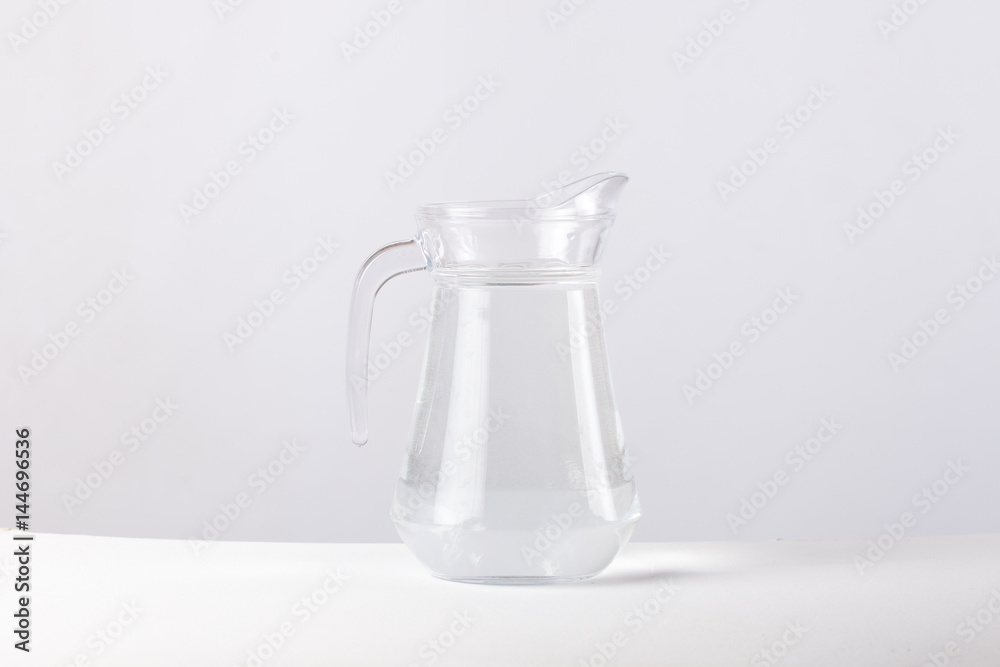 glass jug with water isolated on white background glass jug with water isolated on white background