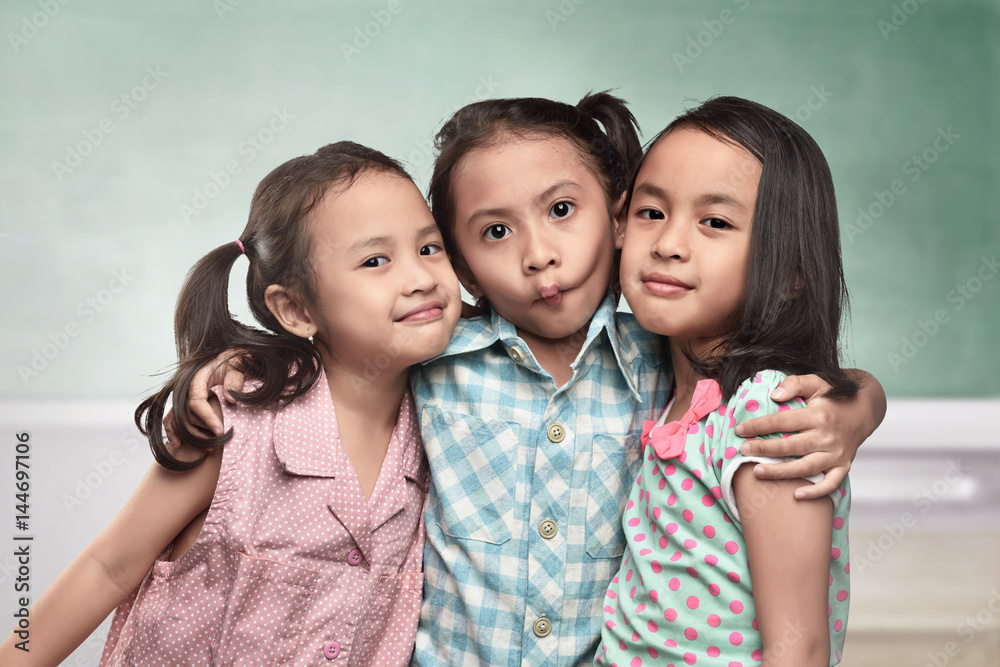 Group of asian kids with funny expression standing Group of asian kids with funny expression standing