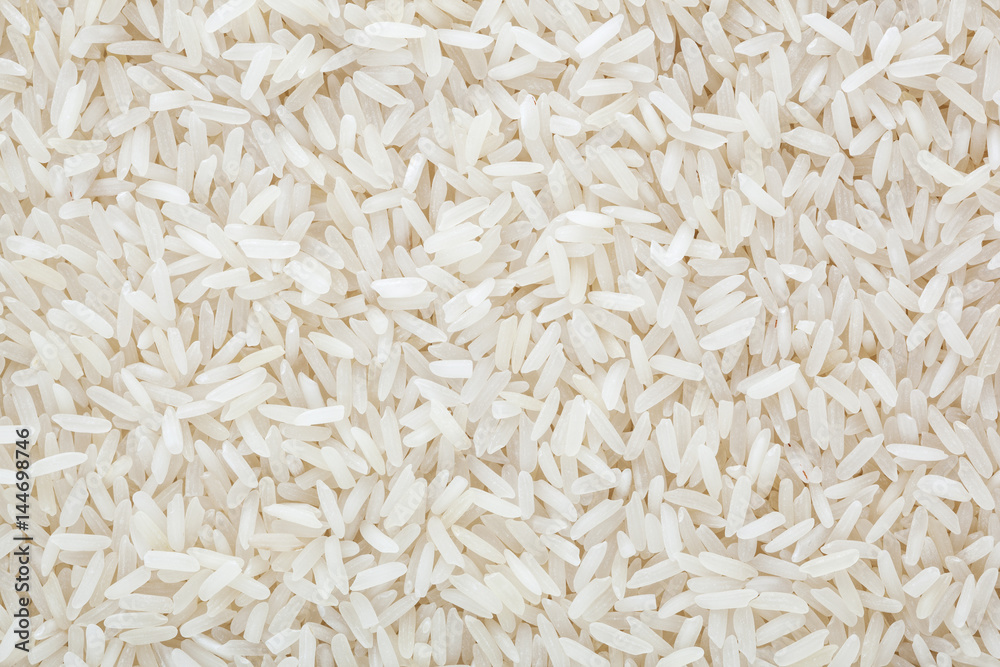 Uncooked white long-grain rice background Uncooked white long-grain rice background