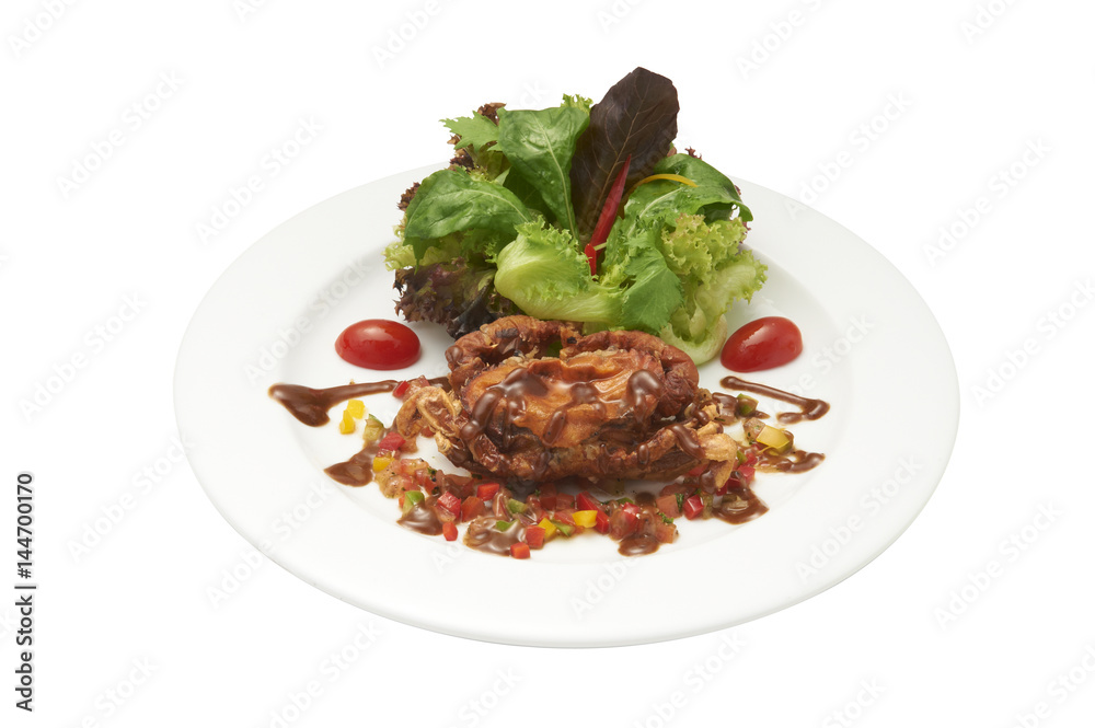Isolated of salad and deep fried soft-shelled crap in white plate. Clipping path and white background. Isolated of salad and deep fried soft-shelled crap in white plate. Clipping path and white background.