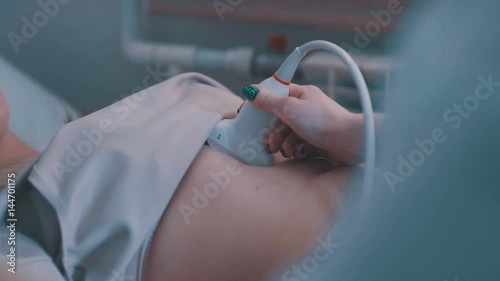 Wallpaper Mural Ultrasound machine doctor s hand usg investigation USCG. Closeup of woman getting an ultrasound scan on abdominal by doctor. Young woman on ultrasound of abdominal cavity. Torontodigital.ca