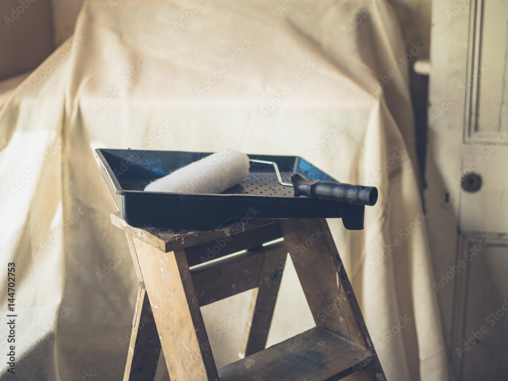 Obraz premium Paint roller on stepladder