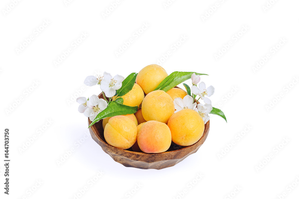 Fresh apricot in wooden bowl isolated on white background Fresh apricot in wooden bowl isolated on white background