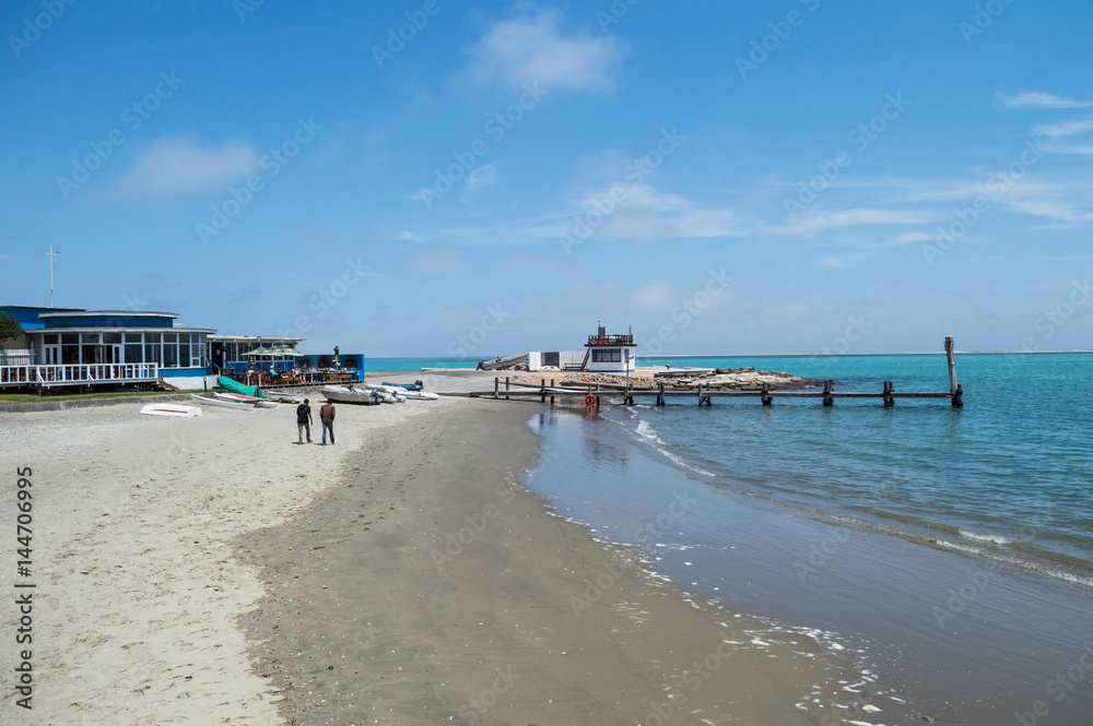 Bay with Turquoise Sea and a Pier in Walvisbay, Namibia