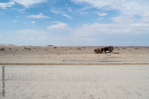 Burnt Out and Flipped Over Car Wreck in the Desert between Walvis Bay and Solitaire in Namibia