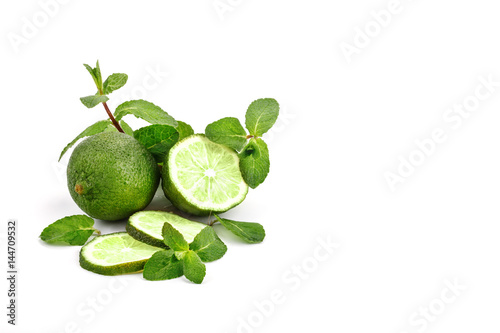 Lime. fruit with a half isolated on whiteFresh tasty lime fruit with mint leaves. © Anna