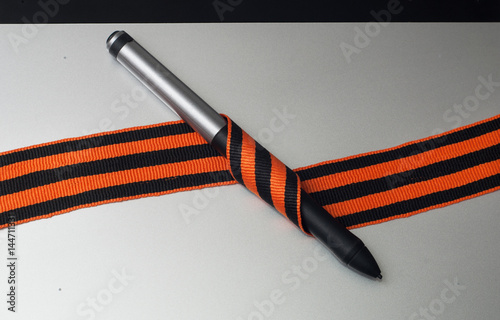 Graphic tablet and pen for illustrators and designers, St. George ribbon, photo