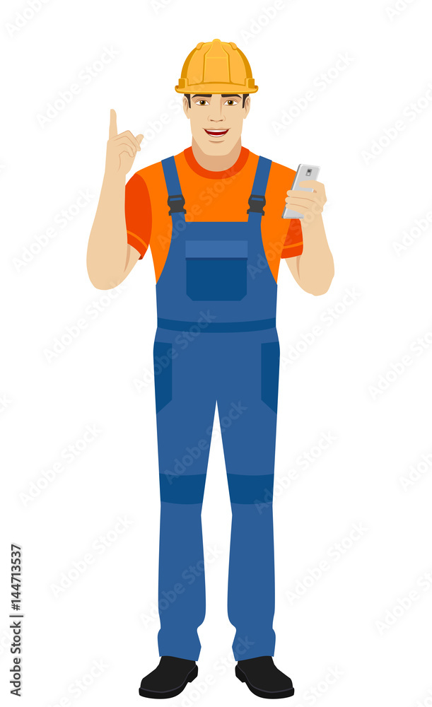 Builder with mobile phone and pointing up Builder with mobile phone and pointing up