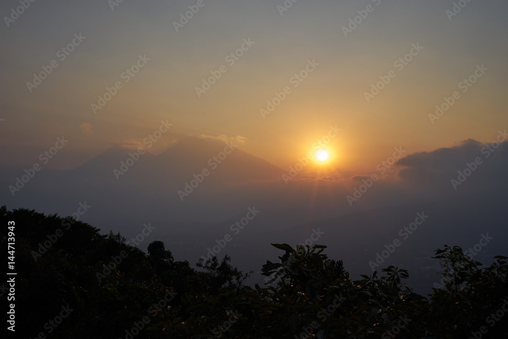 Sunset in volcanic highlands of Guatemala / Evening hours on volcano trekking tour next to Antigua in Guatemala 