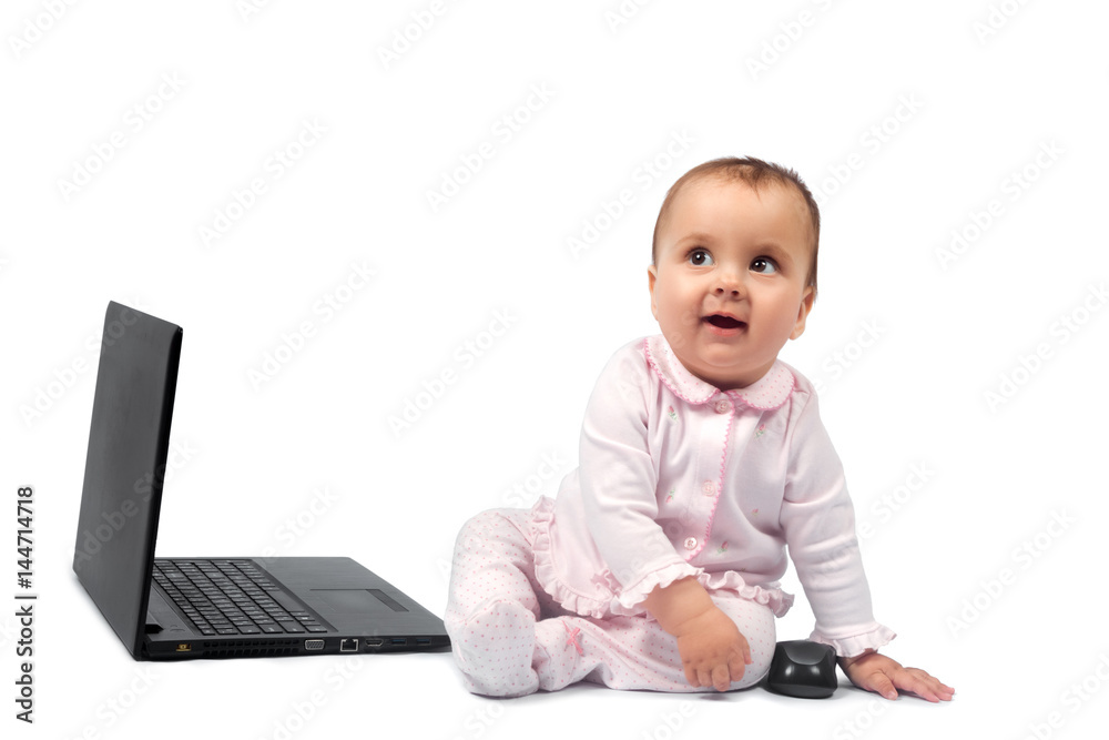 Smiling baby and laptop isolated on white Smiling baby and laptop isolated on white