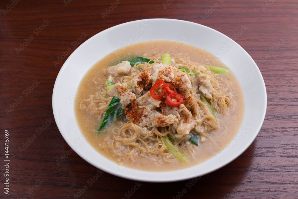 Fried noodle with pork and vegetable. Thai-Chinese noodle dish Fried noodle with pork and vegetable. Thai-Chinese noodle dish