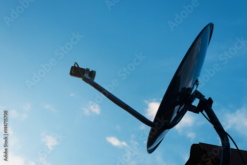 Satellite antenna against with blue sky background
