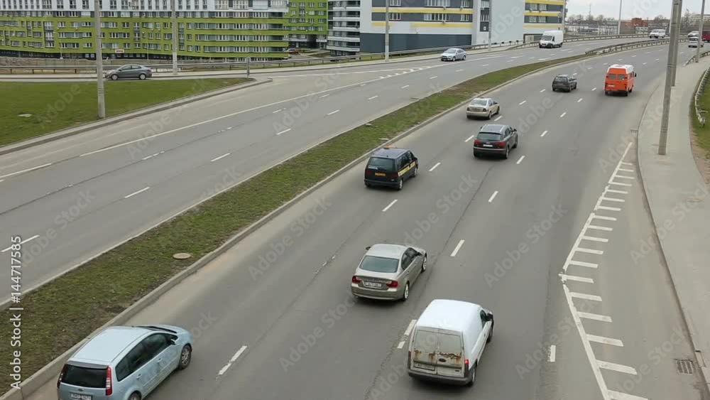 Time lapse traffic of car on busy highway infrastructure in city.