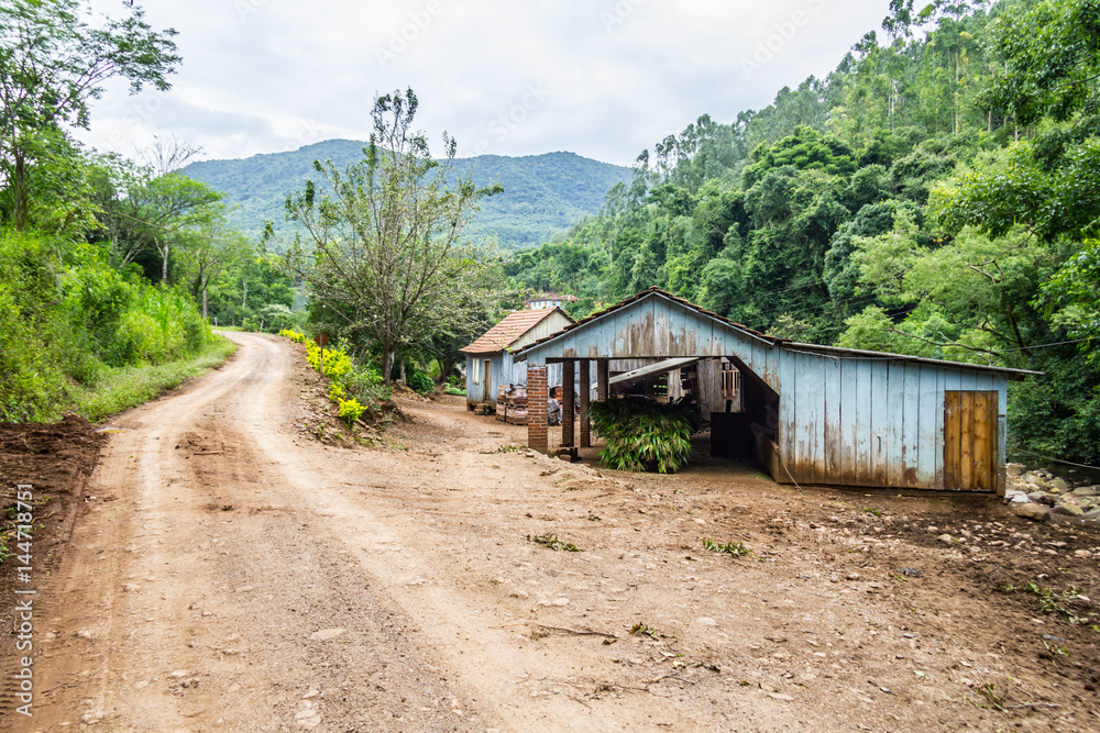 Small Wood Farm House and dirty road Small Wood Farm House and dirty road