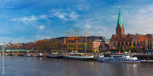 Embankment of the Weser River and Protestant Lutheran Saint Martin Church in the old town of Bremen, Germany. Panoramic view.