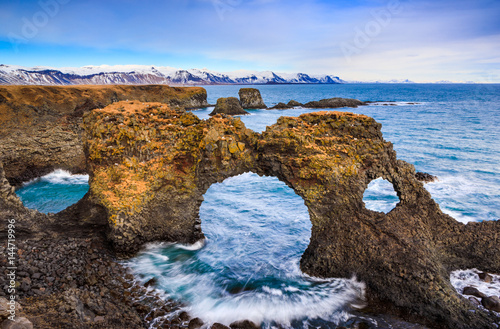 Natural rock gate in Arnarstapi, Snafellsnes peninsula, Iceland photo
