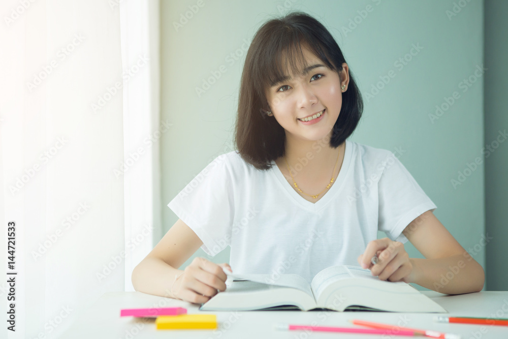 Portrait of a beautiful Asia woman studying at home Portrait of a beautiful Asia woman studying at home