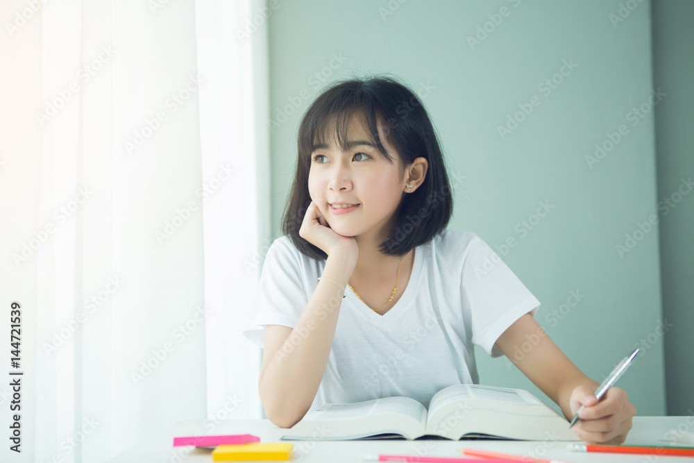Portrait of a beautiful Asia woman studying at home Portrait of a beautiful Asia woman studying at home