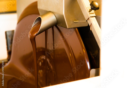 Liquid chocolate mixerl in chcolate factory photo