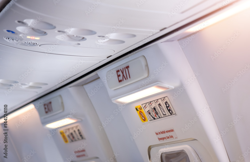 Aviation safety, Emergency exit sign on plane Aviation safety, Emergency exit sign on plane