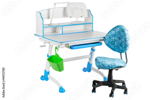 Blue chair, blue school desk, green basket and desk lamp