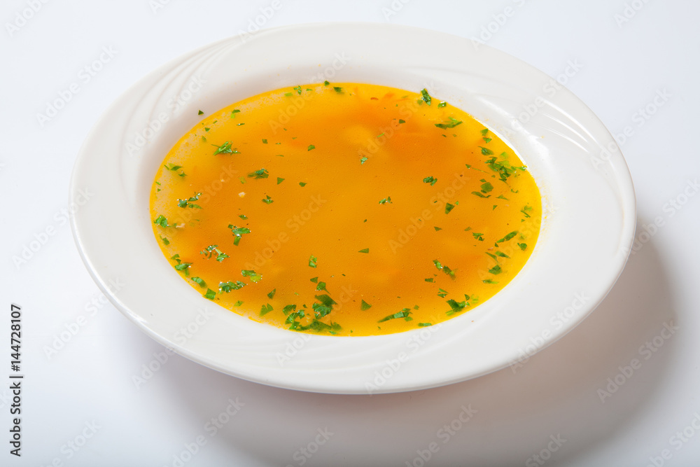 Fresh vegetable soup made of green bean, carrot, potato, red bell pepper, tomato in bowl