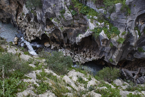 look down into a gorge at Caminito del Rey